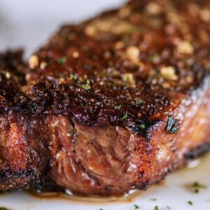 barbecued new york strip steak with seasoning